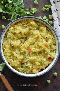 Bowl of Green Peas Khichdi topped with Cilantro.