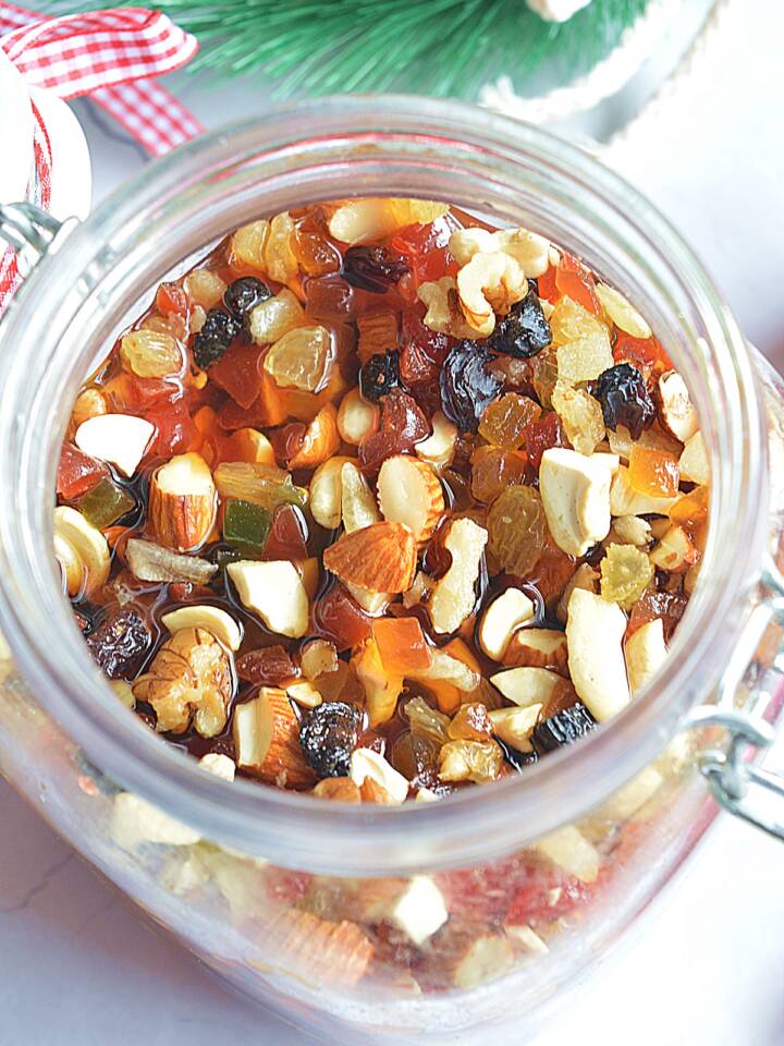 Chopped Dry Fruits and nuts soaked in Rum in a Glass Jar.