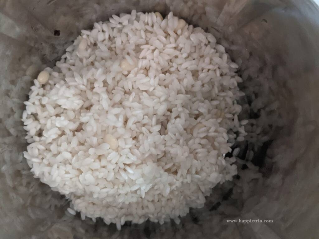 Soak raw rice in water for 3 hours. After soaking drain the rice and add the soaked rice to a blender