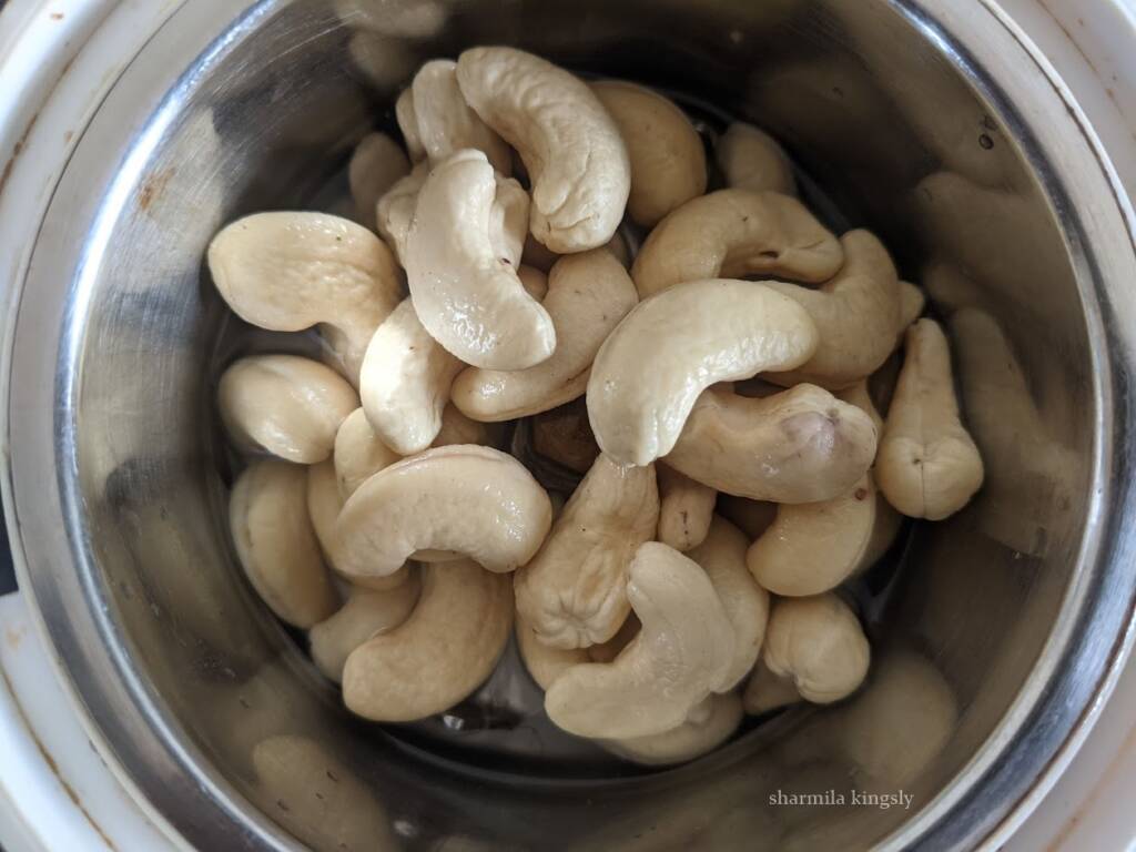Soak the cashew nuts in hot water for 30 mins.