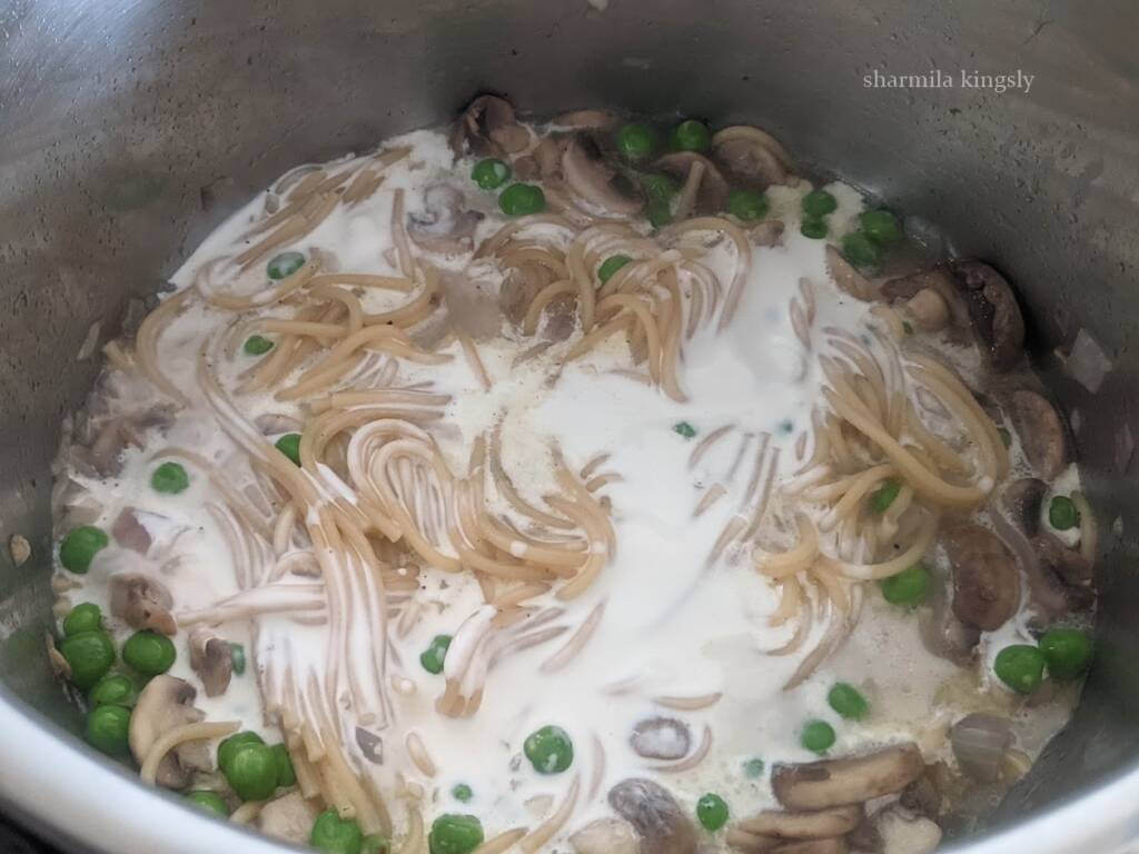 Now add ½ cup of fresh cream. Mix once and cook for 3 mins and then switch off the Instant Pot. Use heavy cream instead of fresh cream for a creamier pasta.