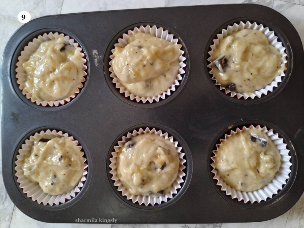Prepare a muffin tray with muffin liners. Scoop out equal portion of batter in all muffin liners. Fill ¾ th of the muffin liners. Top it with more chocolate chunks.